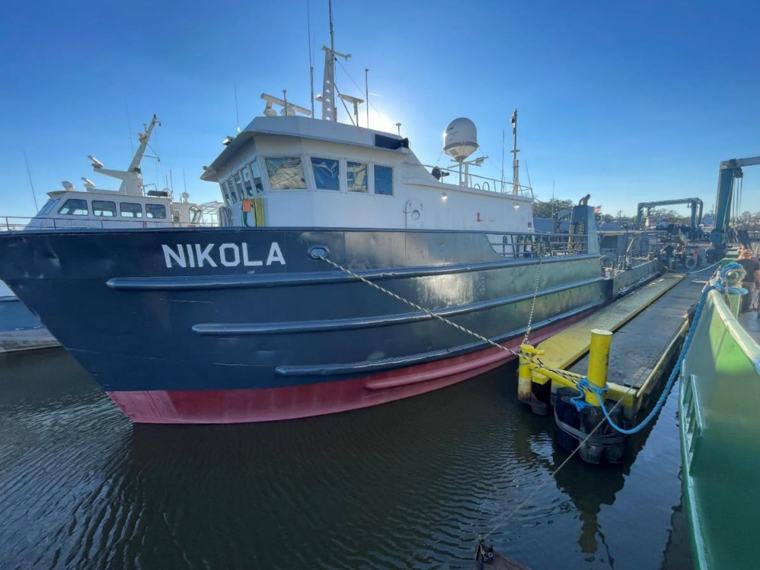 Three-quarter view of the Nikola bow from the pier