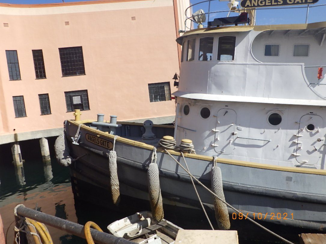 The tug Stryker, formerly Angels Gate, moored alongside a pier